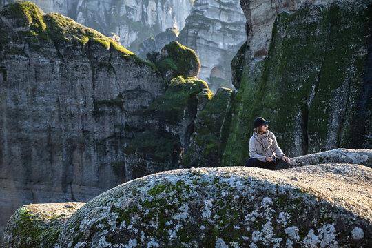 Woman hiking up to a monastery in Meteora