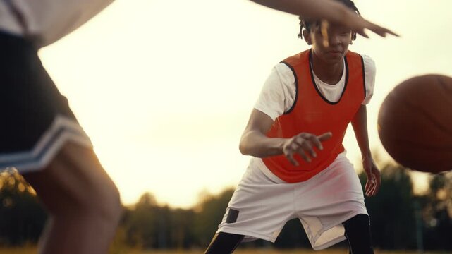 Skilled basketball training in nature, portrait of young black player in motion. Carefree african american children playing street ball, team training together, future champions of national league