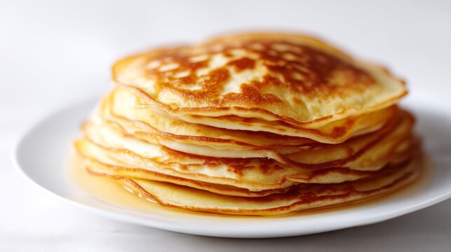 A delicious stack of golden pancakes ready to be enjoyed. Perfect for breakfast or brunch. Soft, fluffy, and warm. A classic culinary delight on a simple white plate. AI