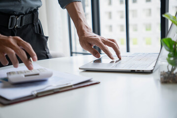 Businessman Calculating Revenue and Planning Business Strategy at Office