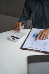 Businessman Calculating Revenue and Planning Business Strategy at Office