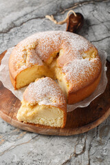 Italian Custard Cake Torta Nua closeup on the wooden board on the table. Vertical