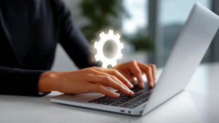 Hands engaged in typing on laptop with cogwheel overlay symbolizing technology advancement. Modern office setting with bright light. Concept of software development, IT consultancy, digital solutions - Powered by Adobe