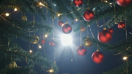 Festive Christmas tree background with glowing red baubles and magical string lights creating a beautiful starburst effect