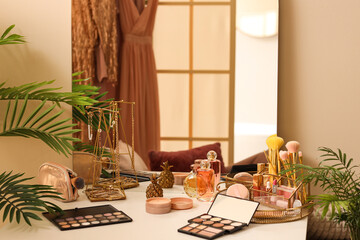 Makeup products on table in dressing room