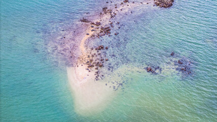 July 5 2025 Coastal Beach with Clear Water and Rock Formations in Natural Setting