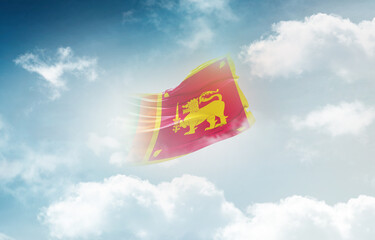 Sri Lanka flag waving light background hidden in the sky.
