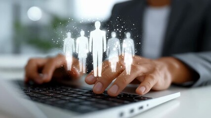 Hands typing on laptop with team silhouettes overlay promoting collaboration and innovation in business environment. Bright office setting with focus on teamwork - Powered by Adobe