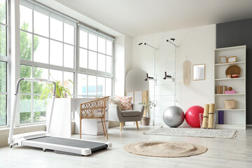 Interior of gym with modern sports equipment