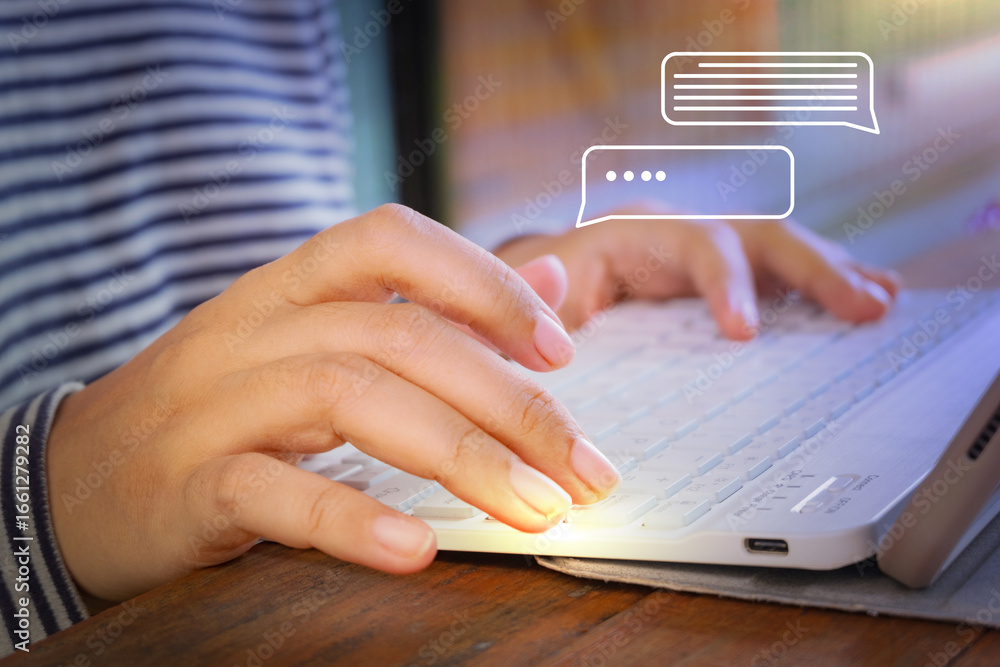 Fototapete hands typing on tablet keyboard with floating hologram chat interface. good for ai communication, me
