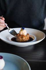 Man eating a delicious Bread & Butter Pudding from a winery in Perth, Western Australia