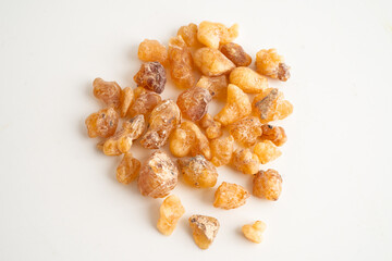 Frankincense or olibanum aromatic resin isolated on white background used in incense and perfumes.