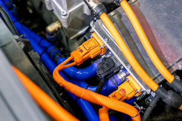Close-up of An engine control unit (ECU) in the engine bay. Close-up of an ECU in an electric car.
