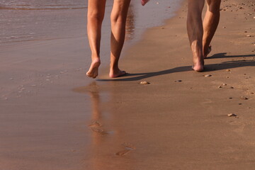 Romantic barefoot walk on the beach