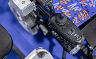Hand control panel for electric wheelchair. joystick and buttons for controlling a wheelchair on a...