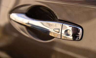 New car door handle. Automatic opening of a car door without a key. Grey door handle grey car....
