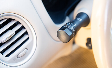The light knob in the car. Multifunction Headlight Console Control Switch knob. Car interior with...