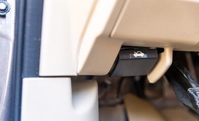 Car bonnet release lever, car interior. Hand pulling car bonnet release - button for open car hood