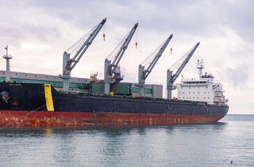 Oil tanker ship loading in port in the harbor of the Tuapse town. Cargo oil tanker is in the port...