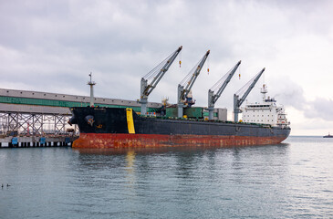 Oil tanker ship loading in port in the harbor of the Tuapse town. Cargo oil tanker is in the port...