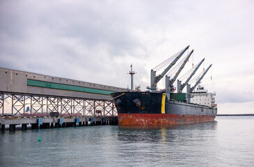 Oil tanker ship loading in port in the harbor of the Tuapse town. Cargo oil tanker is in the port...