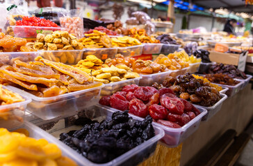 Various dried fruits at an oriental bazaar. Caramelized fruits and a large selection of dried...