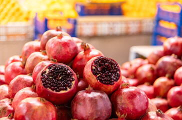 Pomegranate fruit is folded in the form of a pyramid for sale. Red mature pomegranates for sale...