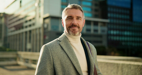 Serious, portrait and business man in city for property agent, real estate investment and travel. Confidence, urban developer and professional with mature person outdoor for opportunity and commute