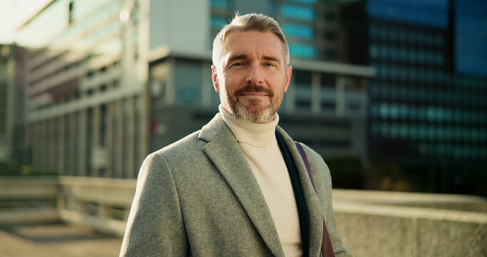 Serious, portrait and business man in city for property agent, real estate investment and travel. Confidence, urban developer and professional with mature person outdoor for opportunity and commute - Powered by Adobe