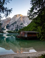 Mountain lake cabin at dawn