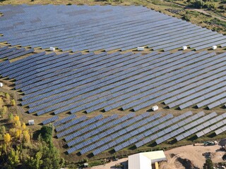 Huge solar powerplant with photovoltaic panels aerial panorama, representing renewable energy...