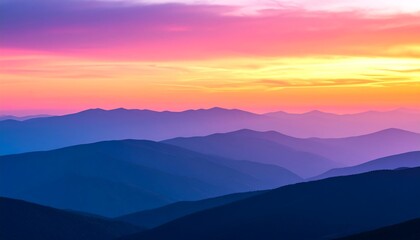 Obraz premium Colorful Sunset Over Distant Mountain Ranges
