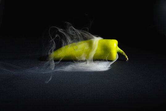 Sri lankan Fresh Hot and Smoky Green Capsicum (Chili Pepper) isolated on Black Background &ndash; Spicy Food Concept