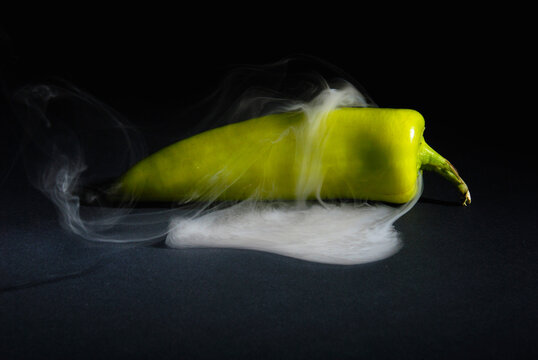 Sri lankan Fresh Hot and Smoky Green Capsicum (Chili Pepper) isolated on Black Background &ndash; Spicy Food Concept