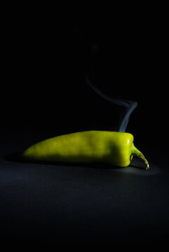 Sri lankan Fresh Hot and Smoky Green Capsicum (Chili Pepper) isolated on Black Background &ndash; Spicy Food Concept