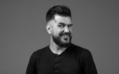 Fototapeta premium Closeup profile side view portrait of his he nice attractive content brown-haired cheerful cheery guy modern look. Bearded man, stylish hairstyle. Perfect beard. Black and white