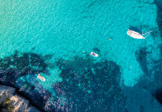 Aerial view of boats in the blue sea in summer