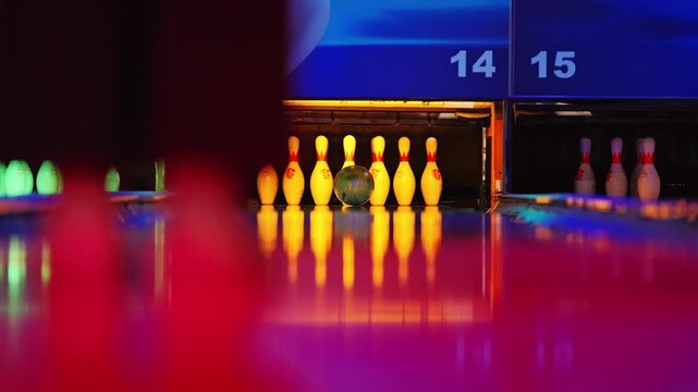 Colorful RGB bowling strike captured in cinematic slow motion perspective
