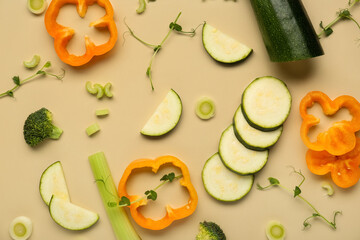 Composition with fresh vegetables and peas micro green on beige background, closeup