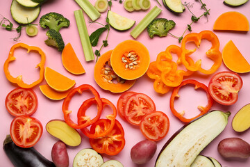 Composition with different fresh vegetables on pink background, closeup