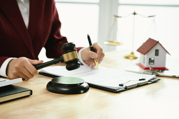 A wooden gavel symbolizes law, justice, and authority in the courtroom, representing judgement,...