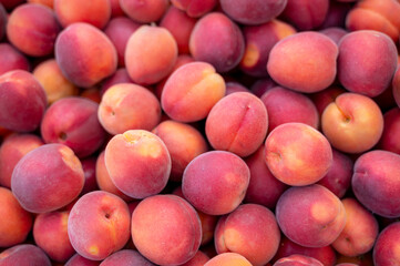 Small ripe peaches in the market