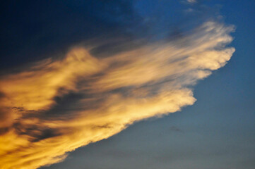 Beautiful storm clouds on a summer night with pinks and blues.