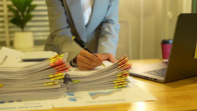 A busy office desk filled with documents, reports, and paperwork symbolizes management, research, finance, and education, highlighting workload, organization, stress, and the importance of information
