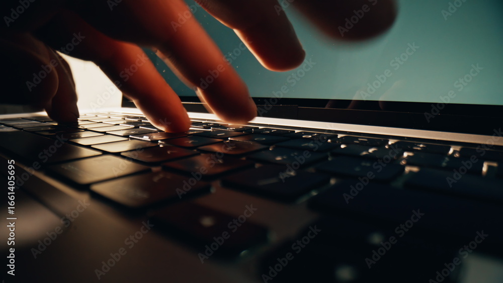 Wall mural man hands typing keyboard of computer in office closeup. businessman working