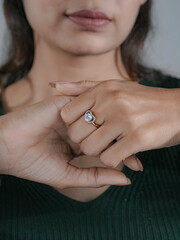 woman elegant finger ring with a white diamond