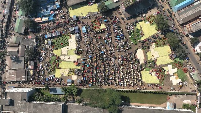 Bogura, Bangladesh - 18 August 2025: Aerial view of a bustling market, a vibrant tableau of commerce with vivid colors and textures under the sun.