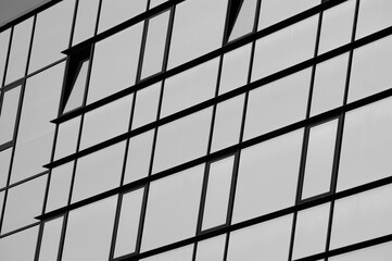 gray background, in the photo is a glass facade of a building