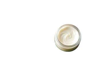 Jar of cosmetic cream with palm leaf on pastel beige background, perfect for beauty, skincare, and flat lay photography projects.