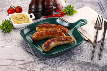 Delicous natural roasted sausages in the plate